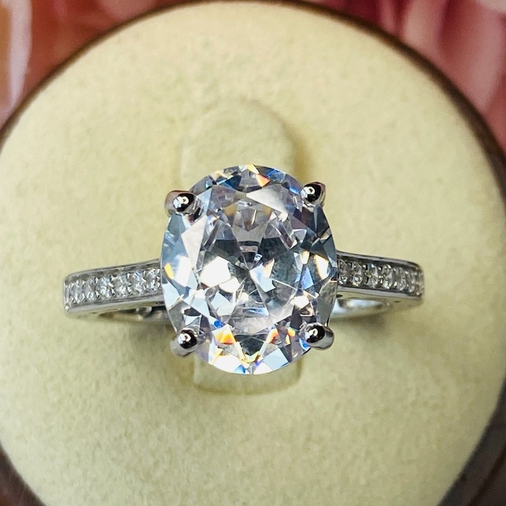 White Oval Cubic Zirconia Rhodium Over Sterling Silver Engagement Ring S…